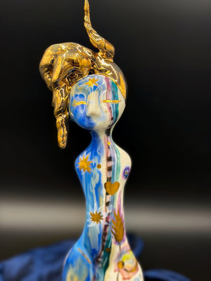 Decorative figurine with a gold on a black background