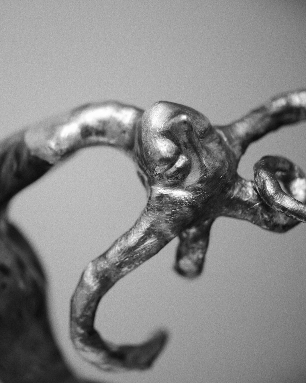 sculpture that bends backwards with gold