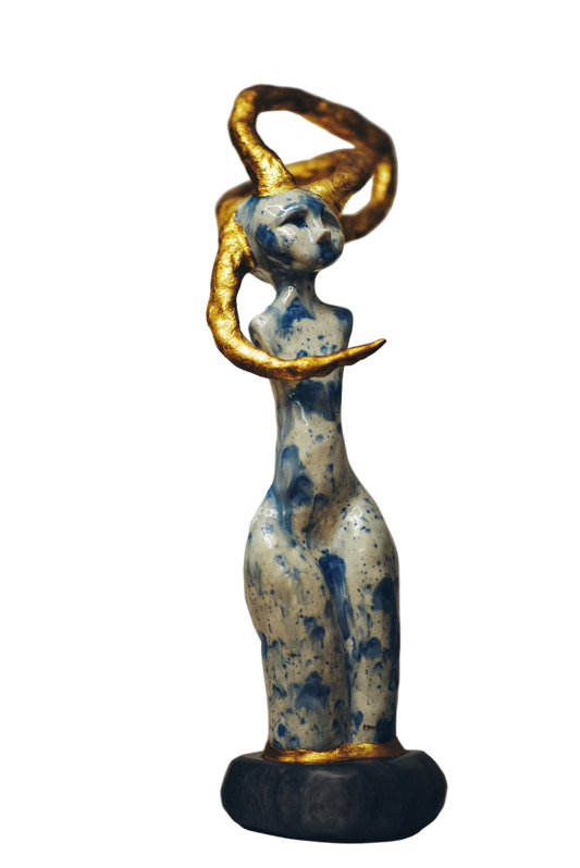 Abstract sculpture of a figure with blue and gold elements on a neutral background